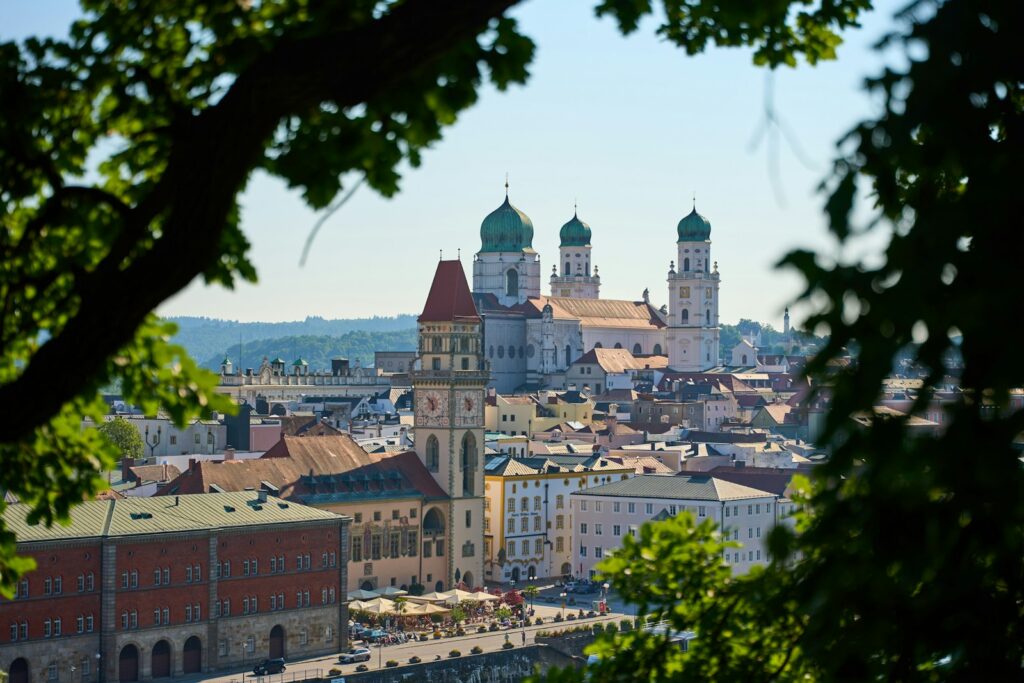 View of Passau old town and St. Stephen's Cathedral framed by trees